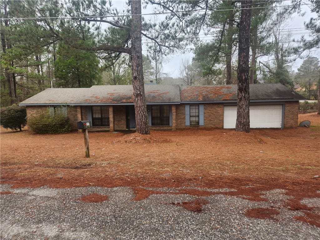 1202 Washington St, Tuskegee, AL 36088, USA, This cozy home offers a classic brick exterior and