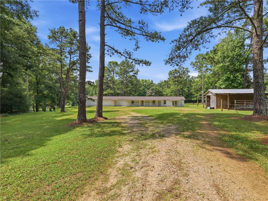 273 Lee Rd 453, Waverly, AL 36879, A long gravel driveway leads to a secluded ranch-s