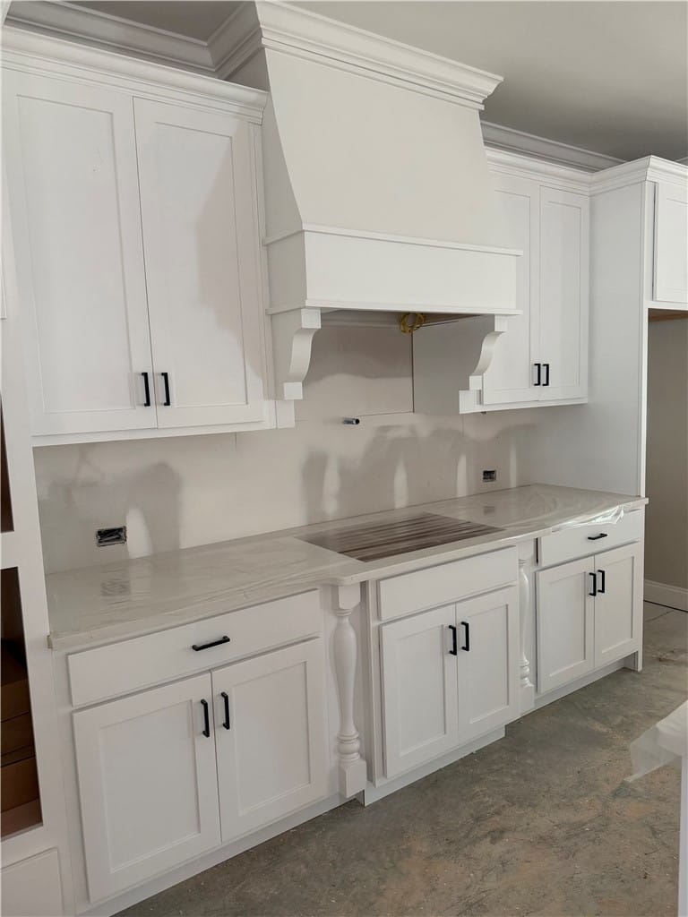 1887 Kennesaw Ln, Auburn, AL 36830, Crisp white cabinetry and sleek counters create an