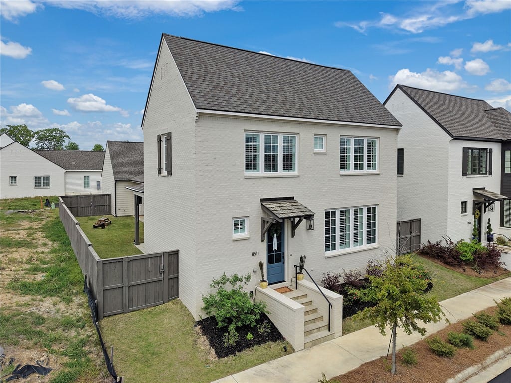 8511 Conduit St, Montgomery, AL 36116, A charming white brick facade welcomes guests with