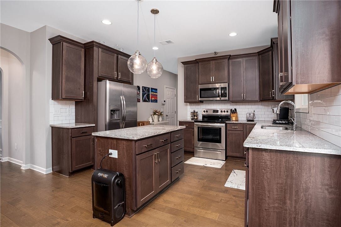 1862 Wildwood Dr, Opelika, AL 36804, A well-appointed kitchen features rich cabinetry,