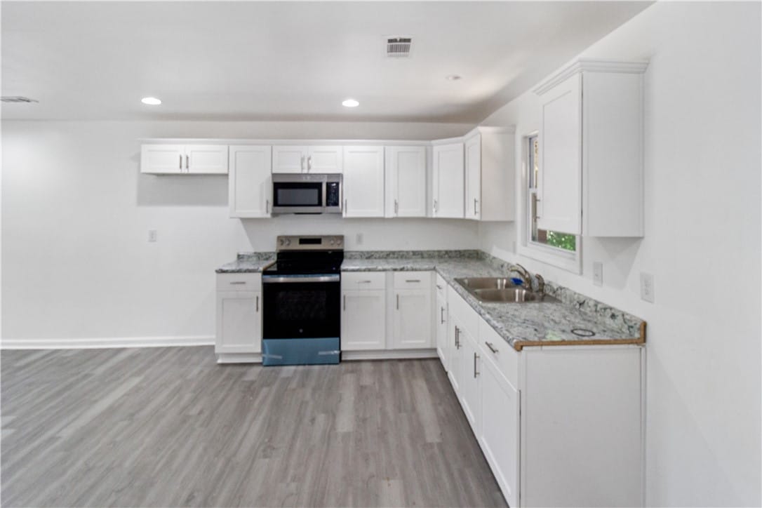 1804 BULLOCK, Opelika, AL, 36801, This modern kitchen features crisp white cabinetry