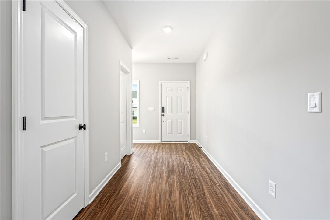 402 gray St, Opelika, AL 36801, Gleaming wood-look floors stretch through this wel