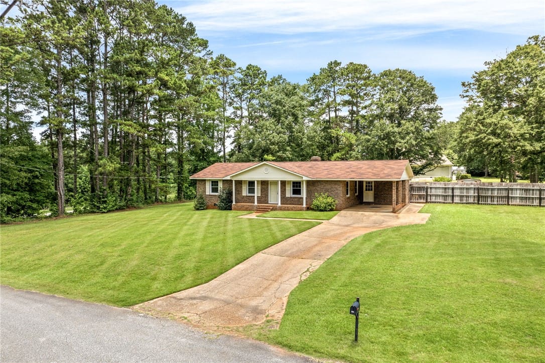 516 Pinecrest Dr E, La Fayette, AL 36862, A classic brick ranch home nestled among mature tr
