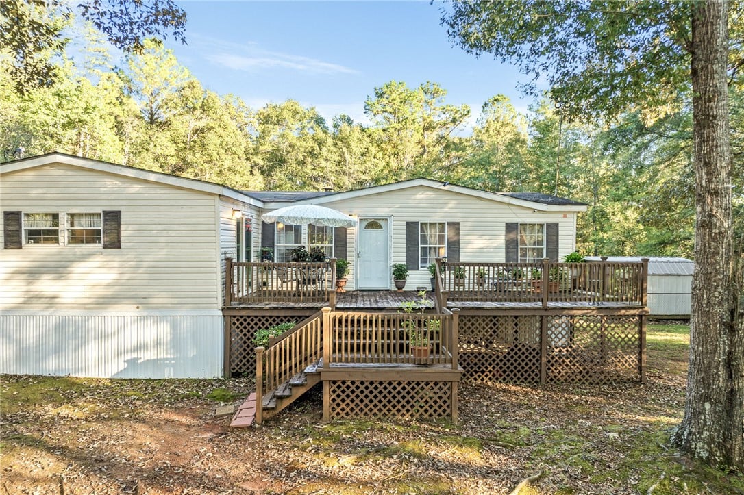 6601 US-29, Opelika, AL 36804, A spacious multi-level wooden deck extends from th