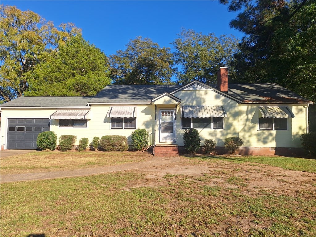 108 N 13th Ave, Lanett, AL 36863, A classic ranch exterior showcases vintage awnings