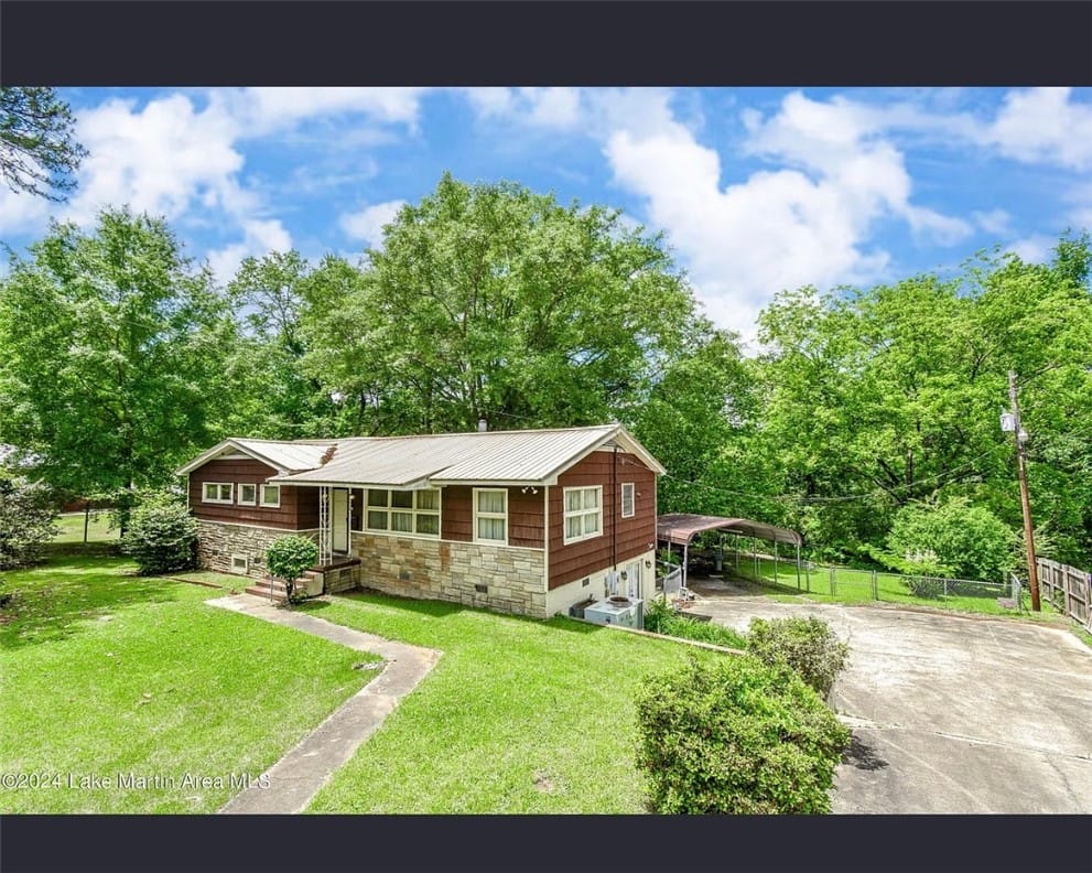 634 Springhill Rd, Alexander City, AL 35010, A charming home nestled amongst vibrant greenery o