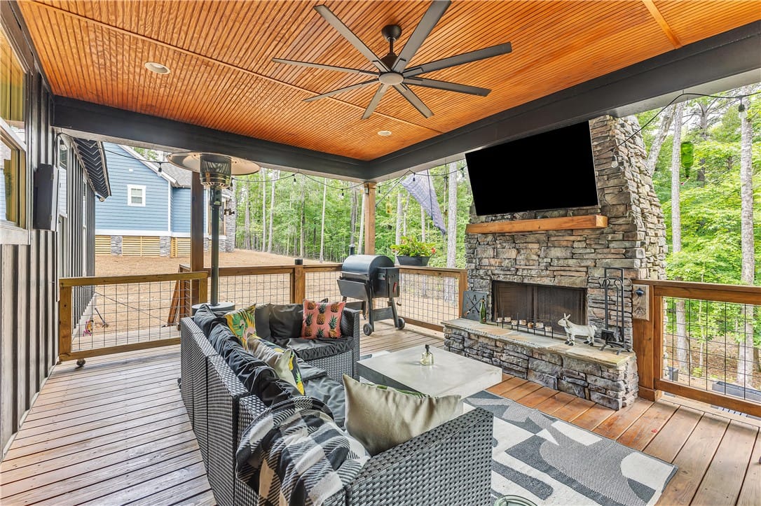 160 River Birch Trl, Dadeville, AL 36853, USA, A spacious covered porch features a stone fireplac