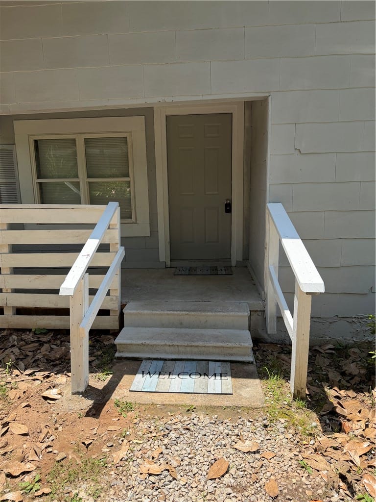 517 Vickerstaff St, Auburn, AL 36832, A welcoming entry point with a classic door and ac