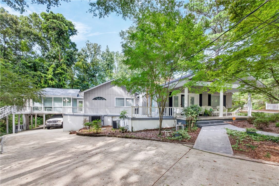 125 ANDREWS MILL, Tallassee, AL, 36078, A spacious elevated residence with expansive decki