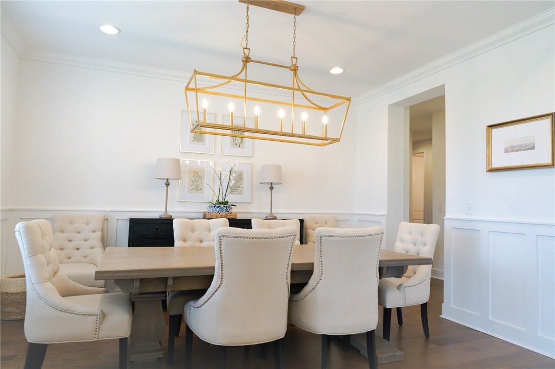 2740 Partridge Ln, Auburn, AL 36879, A refined dining space features a golden chandelie