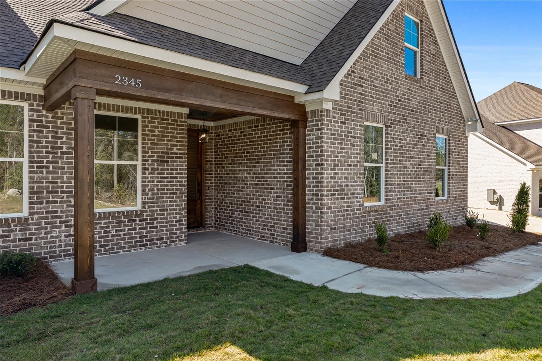 2345 Dalby Pl, Opelika, AL 36804, Rich brick masonry meets heavy timber posts on thi