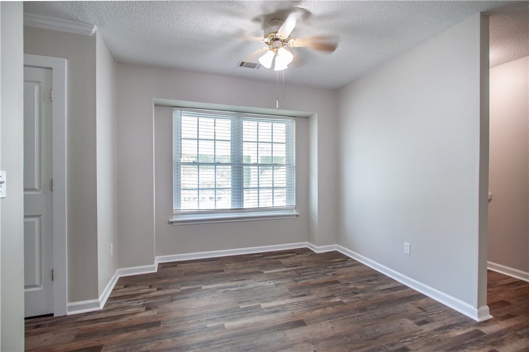 711 Herndon St, Opelika, AL 36801, Hardwood-style flooring and a window with blinds d