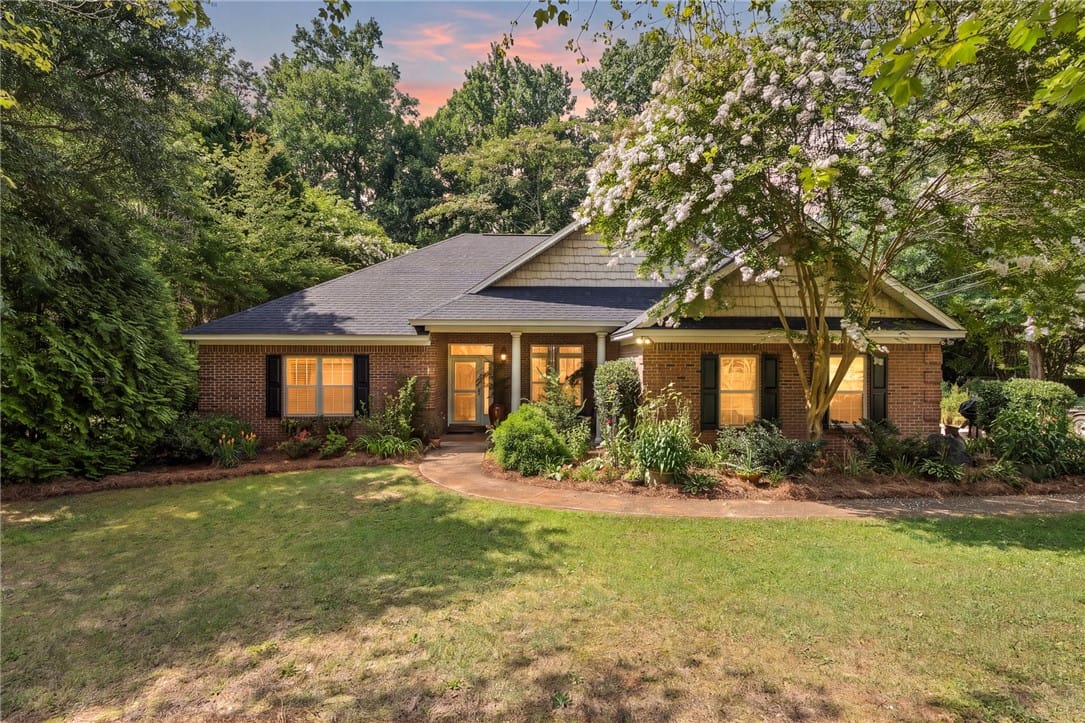 110 N Cedarbrook Dr, Auburn, AL 36830, Timeless brick architecture nestled amidst verdant