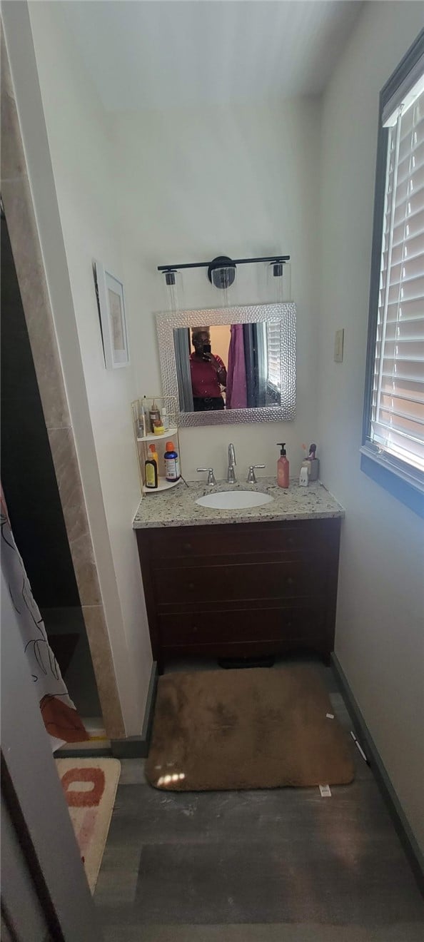 404 Patterson St, Tuskegee, AL 36088, An elegant vanity with stone countertops highlight