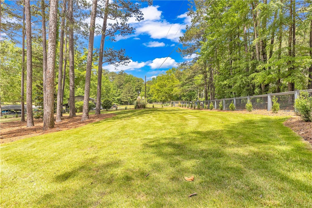 3320 Little Kowaliga Rd, Eclectic, AL 36024, USA, Expansive green lawn framed by mature trees and a