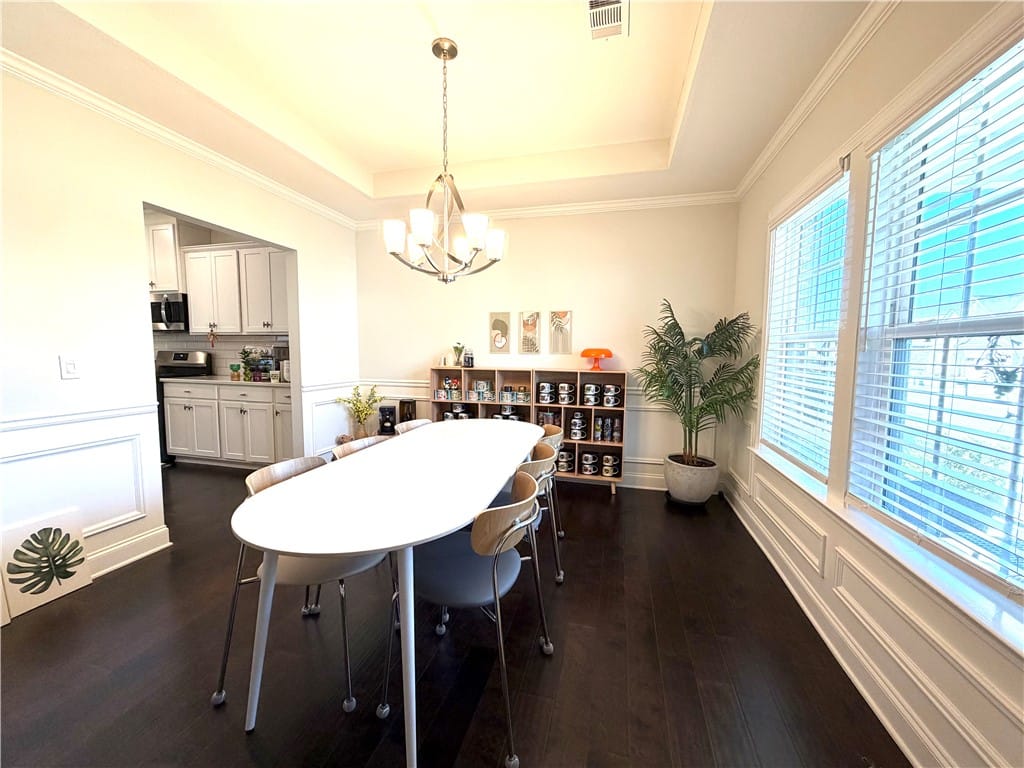 2653 Golf Mill Ct, Auburn, AL 36832, This elegant dining space features rich dark floor
