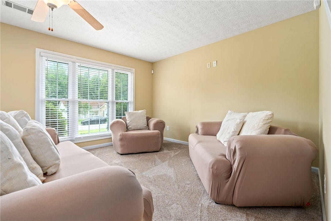2113 Cobblestone Dr, Opelika, AL 36804, A well-lit living space features a large window of