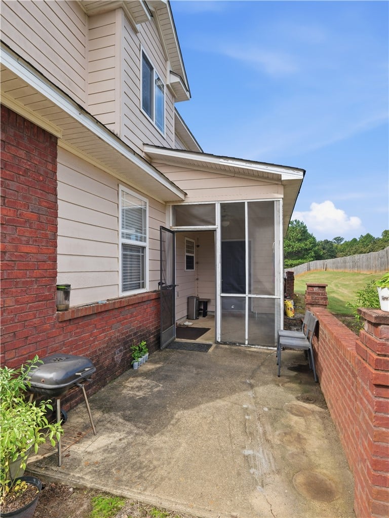 351 Jack Hampton Dr, Auburn, AL 36830, A concrete back patio adjoins a screened porch fra