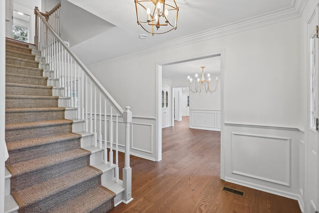 2300 E Doublegate Dr, Albany, GA 31721, welcoming foyer with beautiful staircase & wainscoting