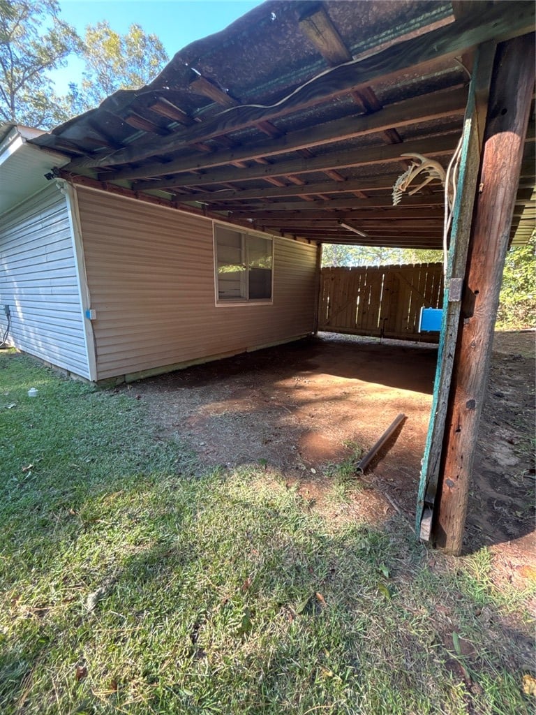 1813 Old Columbus Rd, Opelika, AL 36804, A covered exterior walkway runs alongside the stru