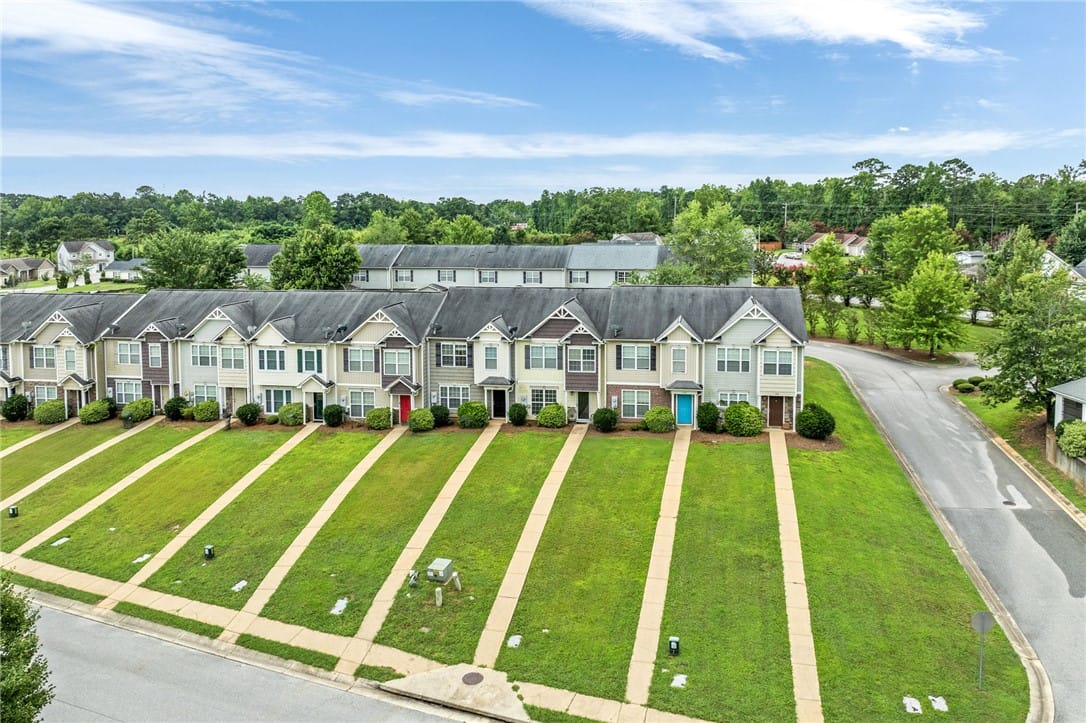 2107 Cobblestone Dr, Opelika, AL 36804, Rows of well-kept townhomes with individual green