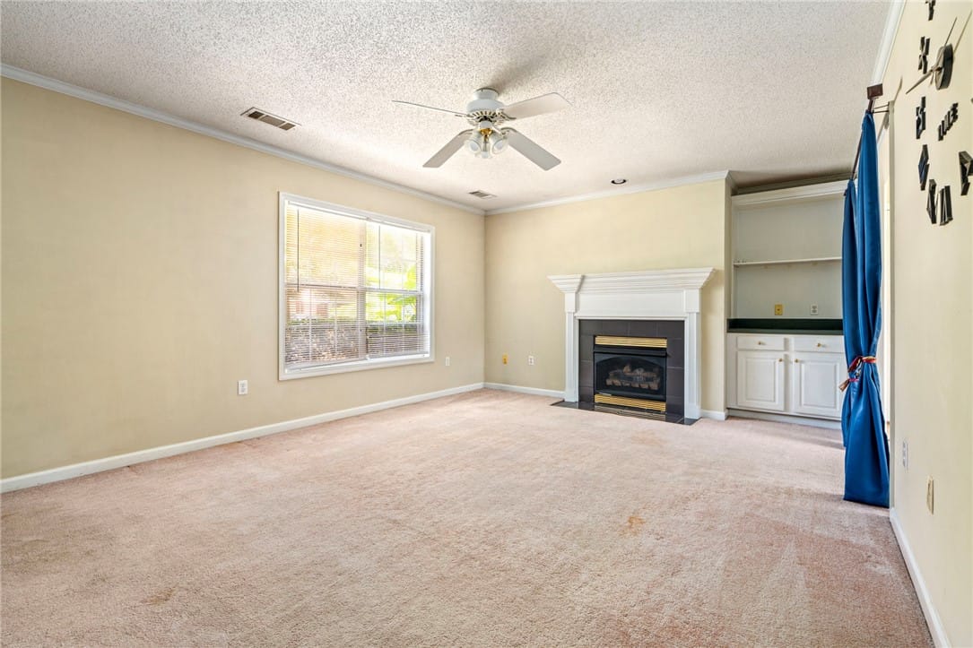 1868 Hillbrook Cir, Auburn, AL 36830, USA, A comforting living area with a fireplace and buil