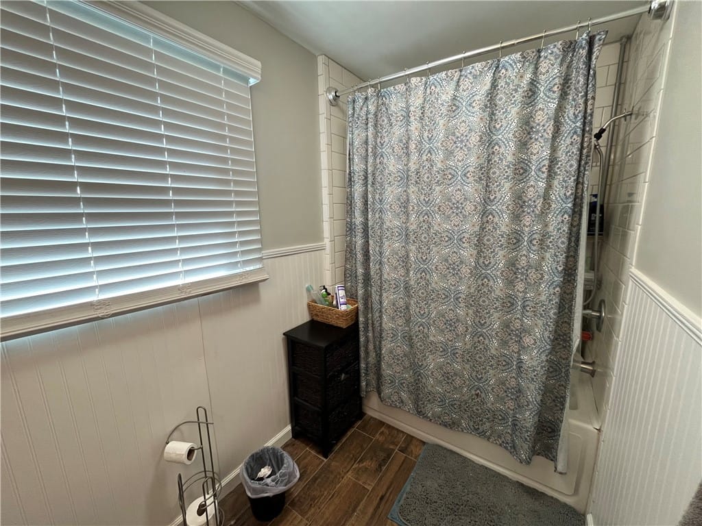 1204 Preston St, Opelika, AL 36801, This bathroom features wood flooring and a shower-