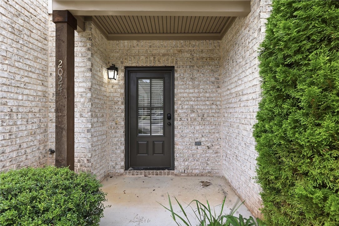 2024 Stephanie Ct, Auburn, AL 36830, White brick walls frame a covered entry featuring