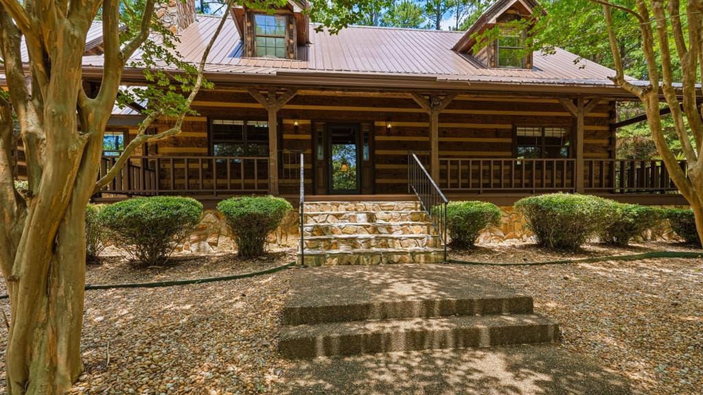 1202 Eddie Martin Rd, Buena Vista, GA 31803, lodge style log home sits waterfront