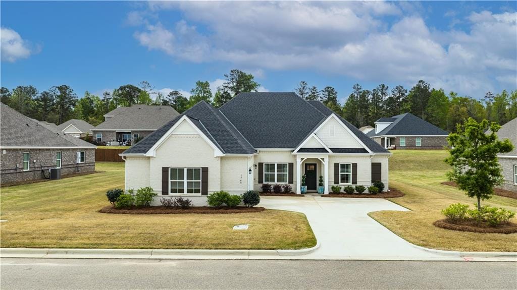 1745 Cushman Dr, Opelika, AL 36801, USA, White brick home with dark shutters and an attache