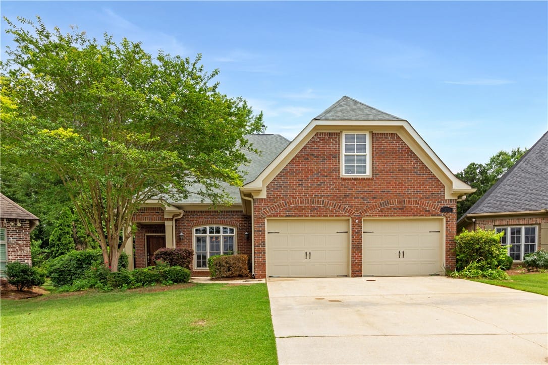 1651 Overhill Ct, Auburn, AL 36830, A classic brick facade welcomes residents, featuri