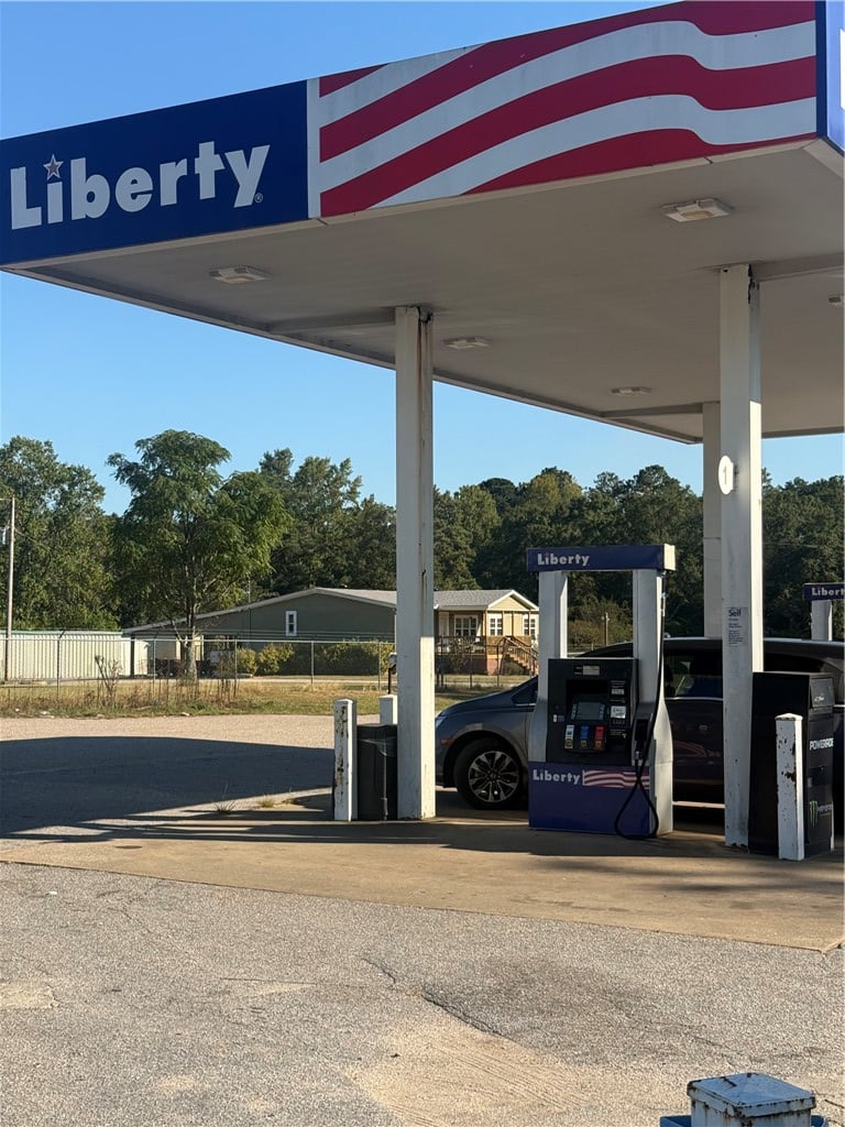 10 LEE ROAD 189, Opelika, AL, 36804, Functional service pumps sit under a metal canopy