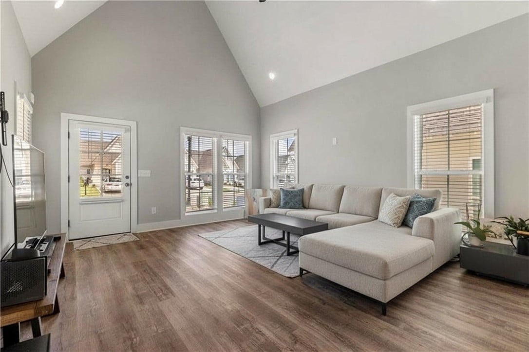 1286 Burrow Cir, Opelika, AL 36801, Vaulted ceilings and rich wood floors define this