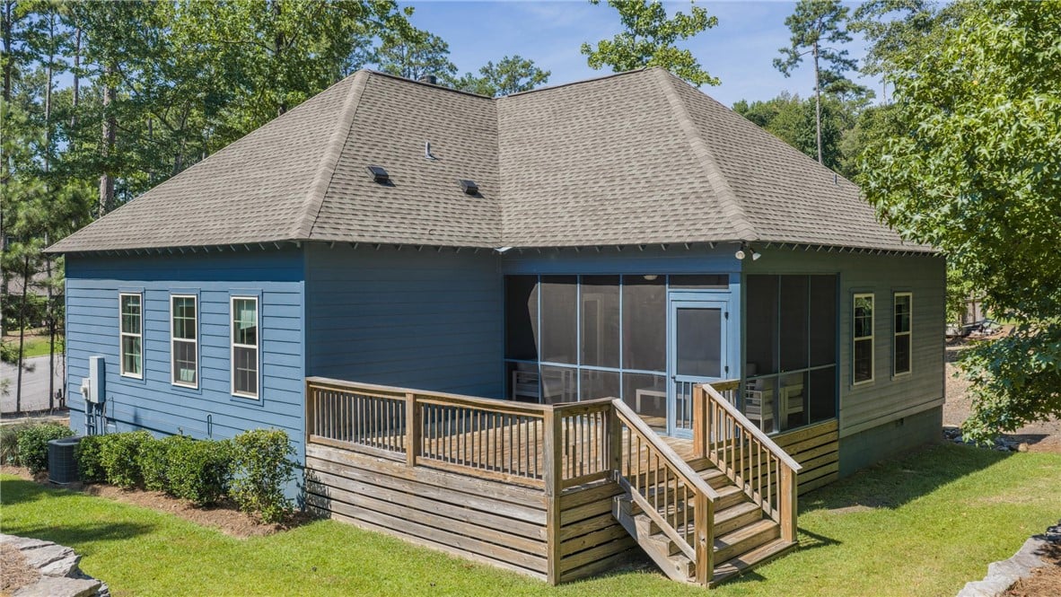 179 Williamson Trce, Tallassee, AL 36078, An expansive wooden deck and screened porch extend
