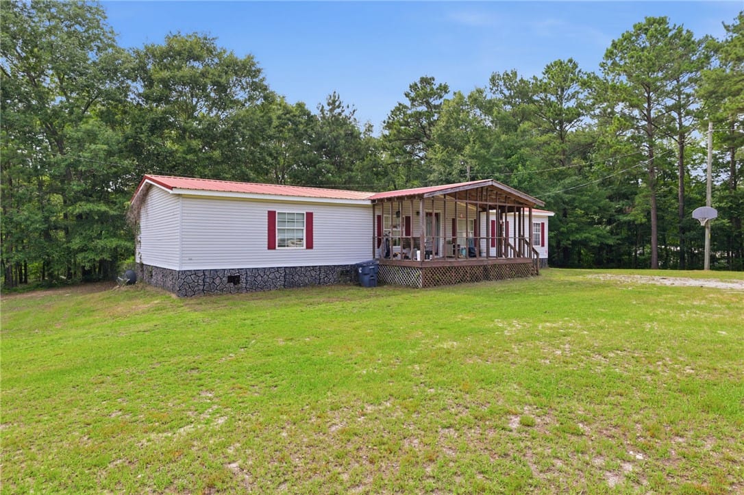 2847 Co Rd 63, Tuskegee, AL 36083, A welcoming front porch extends across this charmi