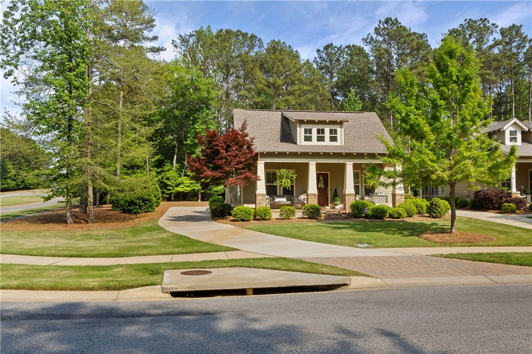 2811 National Village Pkwy, Opelika, AL 36801, A welcoming front porch and manicured lawn invite