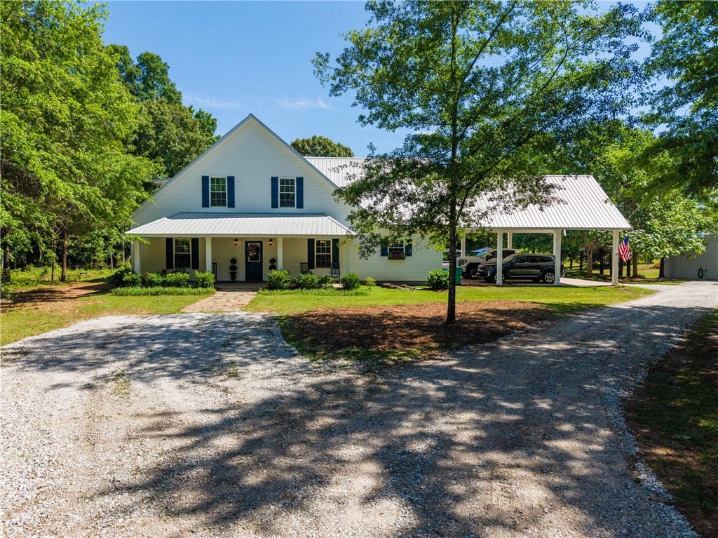 376 County Shop Rd, Dadeville, AL 36853, A classic white country home welcomes with blue sh