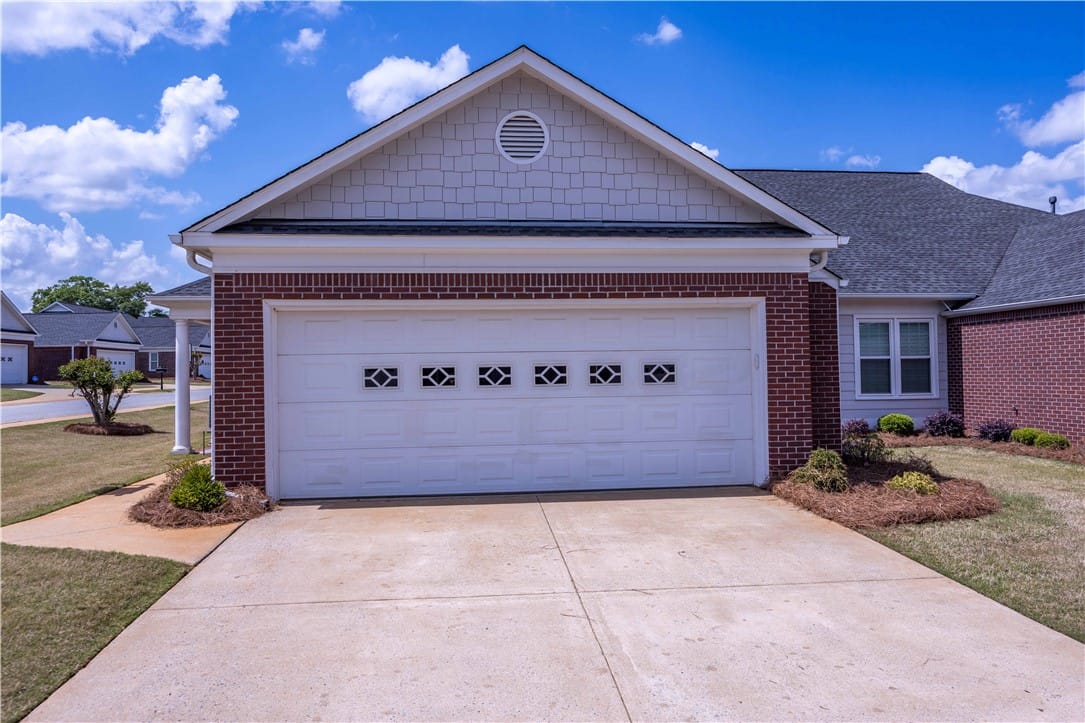 5011 Fall Branch Ct A, Phenix City, AL 36867, A well-maintained concrete driveway leads to a cla