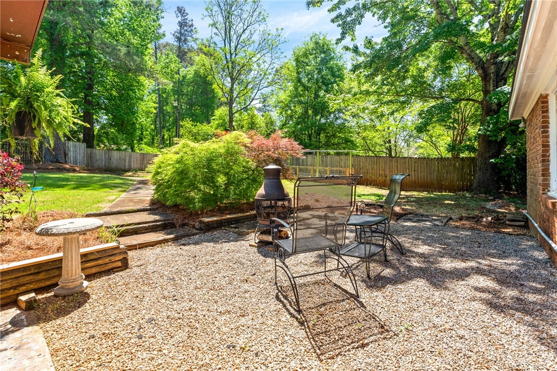 115 N Cedarbrook Dr, Auburn, AL 36830, USA, This spacious backyard features a charming gravel
