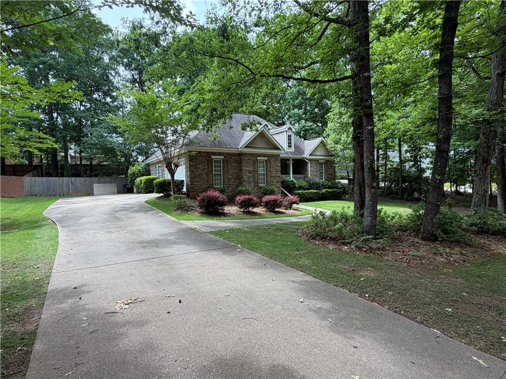 511 Winterburn Ave, Opelika, AL 36801, A graceful paved driveway leads to a classic brick