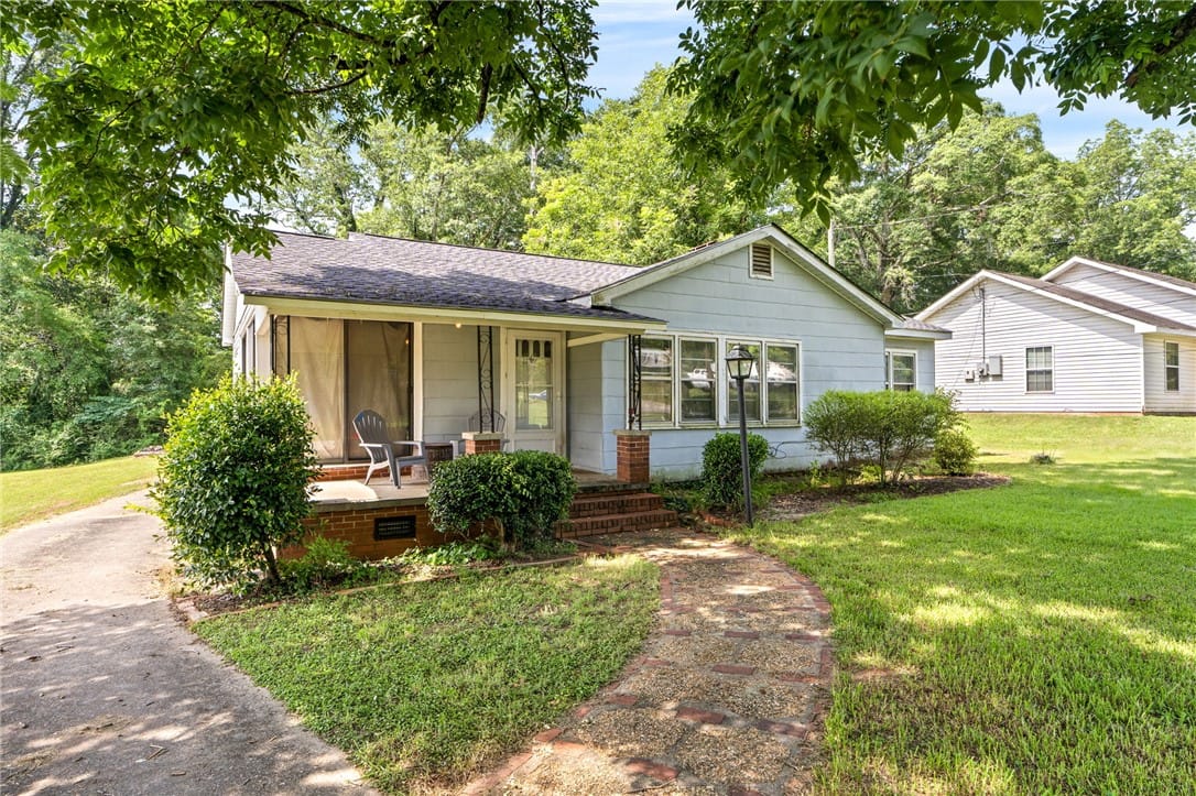 2531 55th St W, Valley, AL 36854, An inviting front porch with brick accents welcome