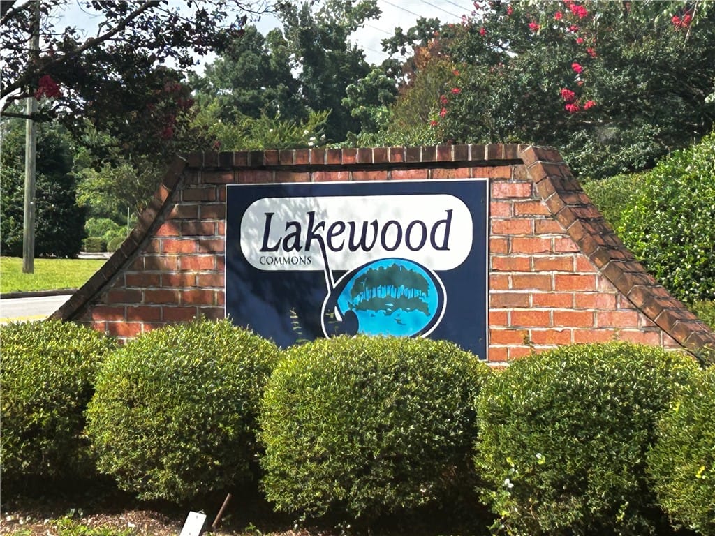 156 E University Dr f203, Auburn, AL 36832, A welcoming brick sign framed by lush landscaping