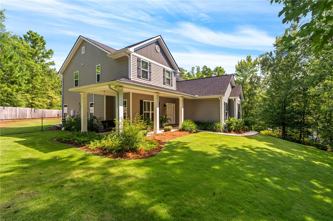 183 Lee Road 735, Opelika, AL 36804, A welcoming front porch leads to this modern home