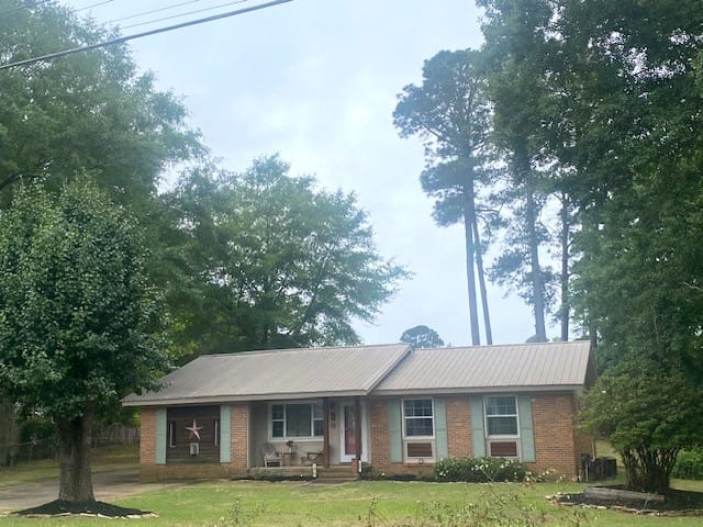 1603 Bruce Ave, Opelika, AL 36801, A charming single-story brick home, shaded by matu