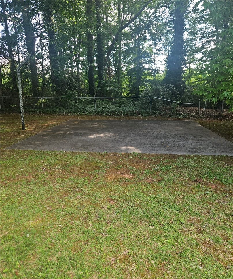 407 Watkins Ave, Opelika, AL 36804, A flat concrete slab offers potential for recreati