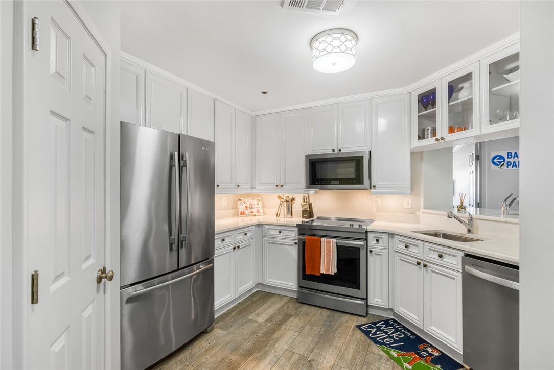 145 E Magnolia Ave Apt 310, Auburn, AL 36830, White cabinetry and stainless steel appliances pai