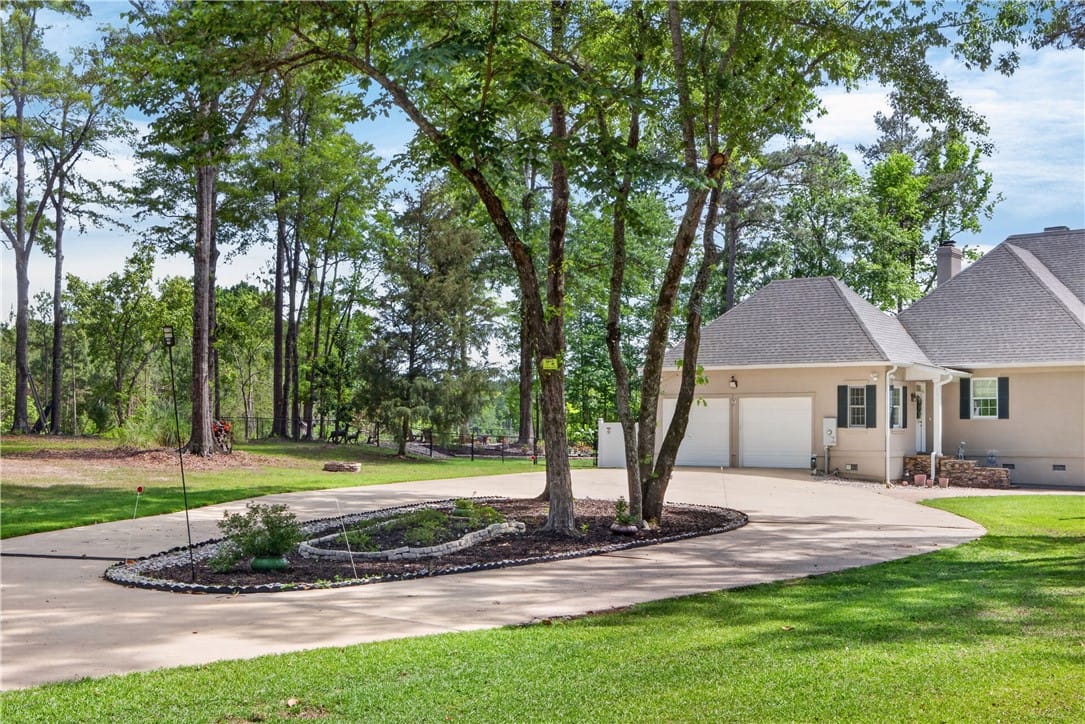 4297 Judge Brown Rd, Valley, AL 36854, This spacious property boasts a two-car garage and