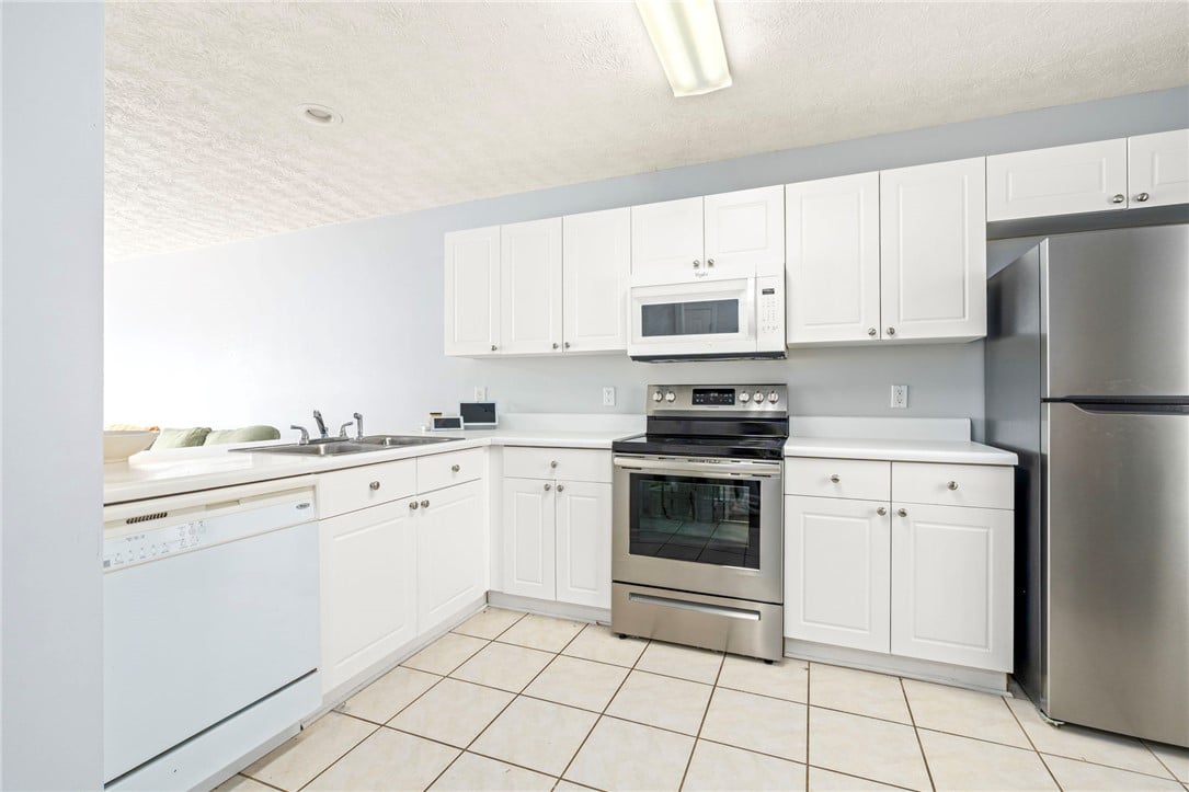 1477 N Donahue Dr Apt 2709, Auburn, AL 36830, White cabinetry and tile flooring define this high
