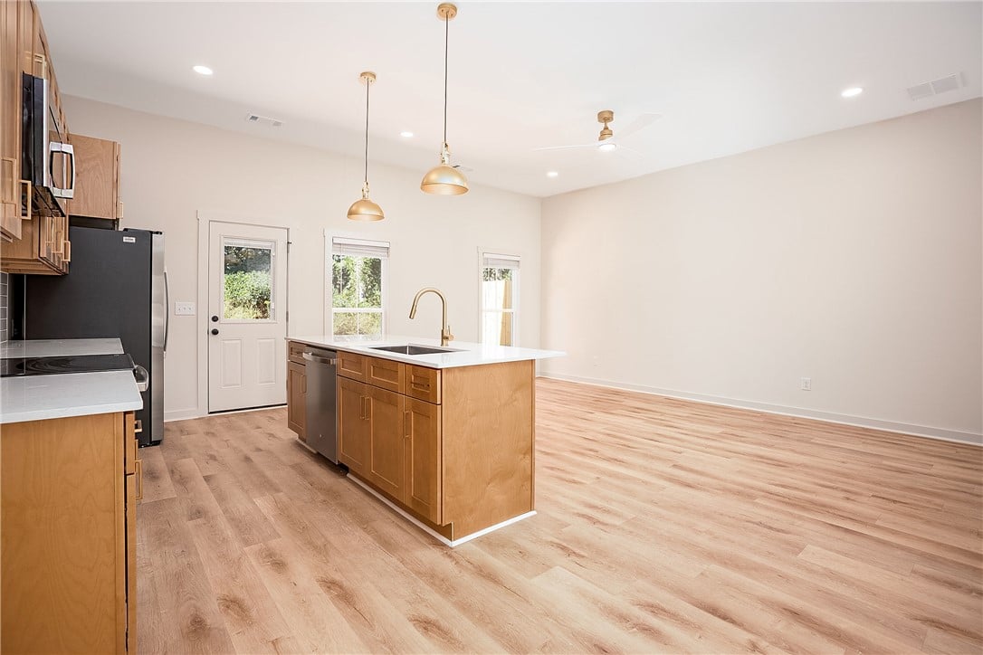 1429 Ashford Court, Auburn, AL 36830, Gleaming wood floors anchor this airy open concept